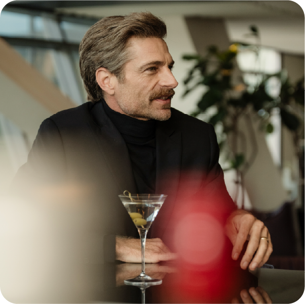 Modern man having a drink at the Caviar Bar